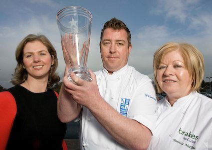 Celebrating its success are left to right, Roisin McKee from People 1st, Andy Aston from Compass and SRC course lecturer Patricia McClean.
