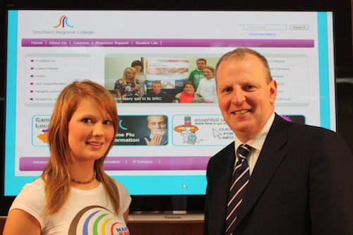 Brian Doran, CEO of Southern Regional College unveils the new SRC website to Cherith Frazer, a student in the Foundation Degree Art & Design.