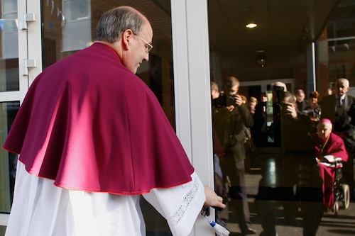 Canon Francis Brown , Principal of St Coleman's College in Newry opens the door at the official opening of the New Saint Coleman's College Buildings.