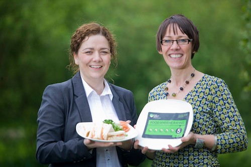 Sinead Murphy, Newry and Mourne District Council, joins Kathryn Baker, Food Standards Agency, to launch the new Food Hygiene Rating Scheme.