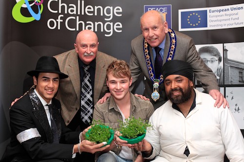 Cllr Charlie Casey, Joint Chairman, Peace 3 Southern Partnership and Cllr Mick Murphy, Mayor, Newry and Mourne District Council present Shamrock to Britains Got Talent act Signature and X Factor singer Lloyd Daniels who performed at the Music Against Racism Concert in Newry City Hall on St Patrick's Eve. The Concert was part of Newry and Mourne District Council's St Patrick's Day Celebrations and was organised by Challenge of Change as part of the Racism is Wrong Campaign. Photo: Columba O'Hare