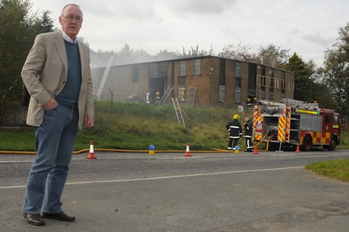John Feehan at the Millvale Road furniture Warehouse as the Northern Ireland Fire Service declare the blaze extinguished. 