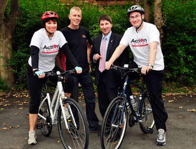Launching CYCLE 40  are L to R Nuala McKeever, Patron of Action Cancer, Eamon McConvey, sponsor and owner, McConvey Cycles, Gareth Kirk, Chief Executive Action Cancer and John McPeake, Chief Executive, Housing Executive.  