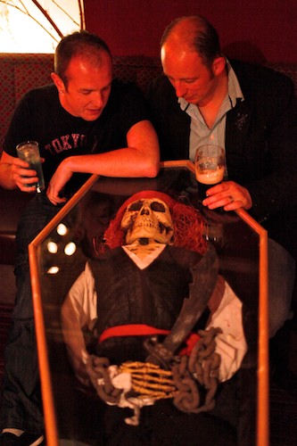 Paul Burns and Declan Traynor have a quiet sup at The Phoenix Bar in Newry. As usual the Phoenix is decorated to the roof for the Halloween season, this time complete with coffins! Photo: Columba O'Hare Paul Burns and Declan Traynor have a quiet sup at The Phoenix Bar in Newry. As usual the Phoenix is decorated to the roof for the Halloween season, this time complete with coffins! Photo: Columba O'Hare