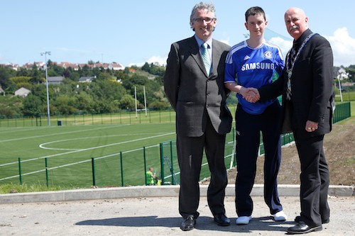 Cllr Charlie Casey, Mayor, Newry and Mourne District Council and St Colman's College Principal Cormac Mc Kinney with Ryan Cinnamond in front of St Colman's new sporting facilities. Photo: Columba O'Hare