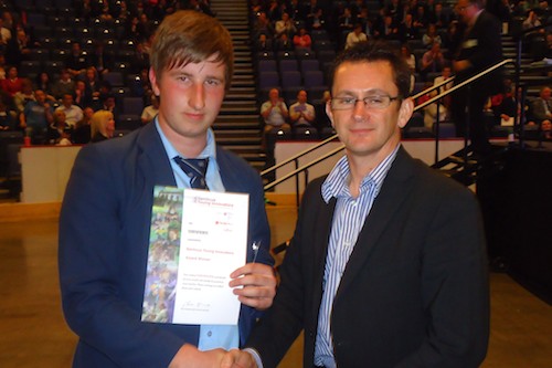 Mark McEvoy receives his award from Dr Paul Herman.