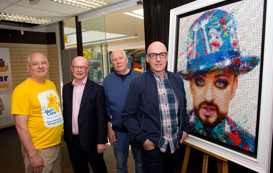 Newry born artist Damian McMahon pictured launching his fundraiser with Phil Kane, Community Fundraiser Marie Curie, Peter Murray,  Buttercrane Centre Manager and Billy McCann, IUR FM (where painting is on display for the next 6 weeks).