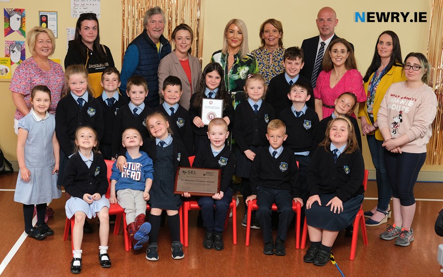 St Malachy's Primary School pupils, staff and special guests at the presentation of their double award. 