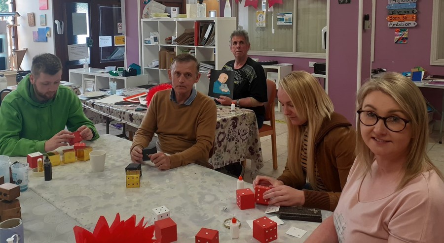 Busy at work in the Head Injury Support Newry centre making the table decorations for the Casino night.