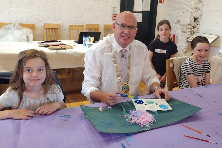 Council Chairman Cllr Michael Savage joining in on the fun at Newry Museum at the Children's summer arts and crafts workshops.
