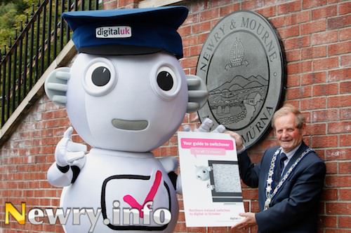Digital switchover mascot Digit Al paid a visit to Mayor of Newry and Mourne, Councillor John McArdle, to make sure he knows how to get ready for 10 October, when analogue television will start to be turned off.  Over 750,000 leaflets will be distributed to households across Northern Ireland in the next few weeks with detailed information about the digital switchover, including a guide on TV equipment options, retuning instructions and how to receive Republic of Ireland channels. 