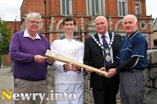 Paddy Duffy, Newry and Mourne Council; Ryan Cinnamond; Charlie Casey, Mayor and Willie McCracken prepare for Tuesdays Torch arrival with a replica. Picture: Columba O'Hare