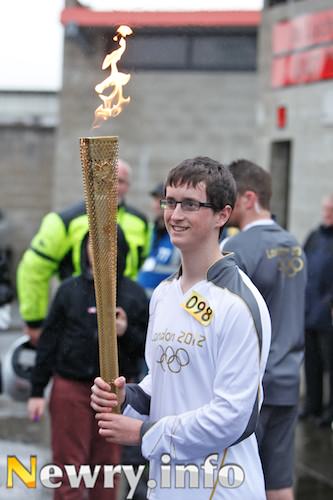 Ryan Cinnamond with the Olympic Torch. Picture: Columba O'Hare