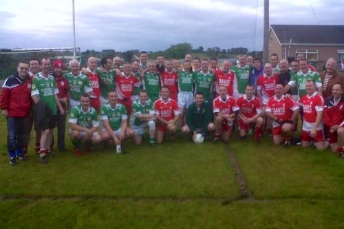 Ryan Cinnamond pictured with referee Owen Reel, players and Backroom staff from the Carrickcruppen and Shane O'Neills Clubs.