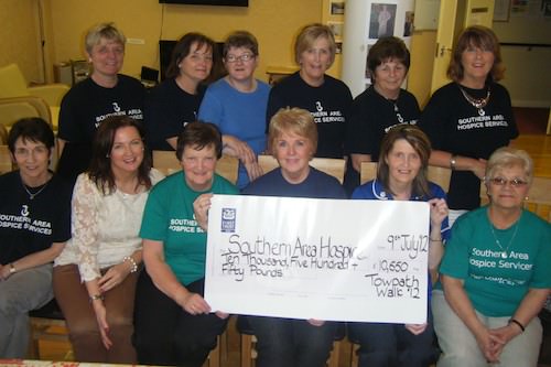 Deborah Kennedy and friends are pictured presenting a cheque for £10,550 to Siobhan McArdle, Senior Fundraiser & Louise Stewart, Hospice Nurse. 