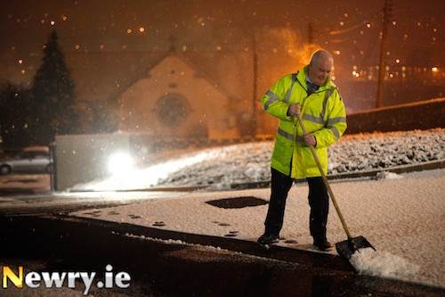 Seamus MacDhaibheid hard at work shoveling snow at Gaelaráras Mhic Ardghail in Chapel Street tonight, the first night of Irish Classes at the new premises. Photograph: Columba O'Hare