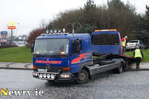 Removing a crashed car from the middle of Fiveways Roundabout. Photograph: Columba O'Hare