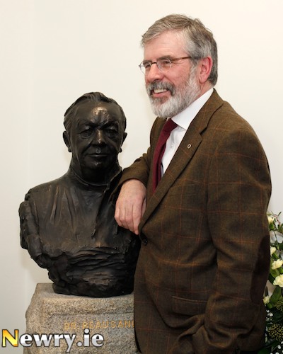 Gerry Adams, TD beside a bust of Brother Beausang who he attributes his love for the Irish Language to. Photograph: Columba O'Hare