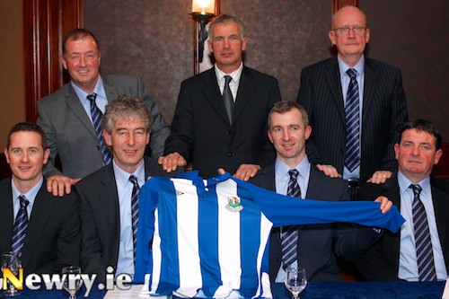Launching Newry City AFC and showing off the new skip at a function in the Canal Court Hotel were front from left: Darren Mullen, Manager; Mickey Keenan, Coach; Raymond Byrne, Assistant Manager and Jervis McCaul, Coach. Back: Martin McLaughlin, Chairman; Ollie Ralph, special guest and Kevin Lyons, Secretary. Photograph: Columba O'Hare