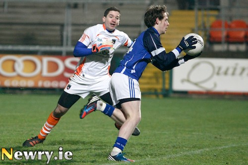 Armagh goalie Niall Geoghegan can only watch as Cavan's Martin Dunne heads goal bound at the Athletic Grounds in the first clash of this years Dr McKenna Cup. Picture: Columba O'Hare