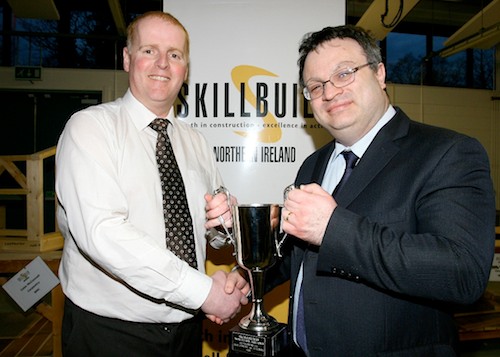Lindsay Bronte, Head of School of Construction and the Built Environment at SRC, receiving Skillbuild NI Department for Employment and Learning Cup from Stephen Farry, Minister for Employment and Learning