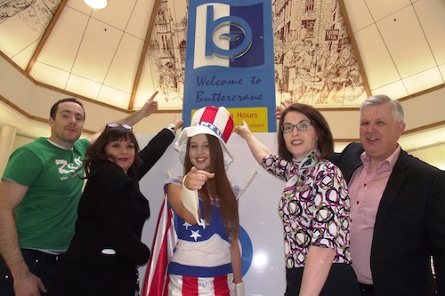 Representatives from some of Buttercrane’s locally-owned businesses are pictured supporting Miss Buttercrane Claire Lyons (centre) who, in the style of Uncle Sam’s famous poster, calls upon the public to support the Buy Local campaign.  The local retailers featured are (from left): James Loughran, Zest; Fiona Denvir, Argento; Alison Dunne, Specsavers; and John Gildea, Bureau de Change.