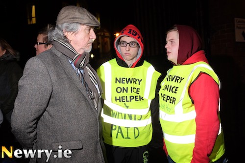 MLA Mickey Brady talks to Newry on Ice workers Eoghan Jones and Keith Dowd at the protest. Photograph: Columba O'Hare