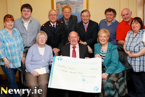 Charities who received £1000 from Charlie Smyth's Newry Pantomime pictured with members of the group. Front from left: Sylvia McElroy; Newry Gateway Club; Charlie Smyth, Newry Panto and Barbara Sands, Newry Samaritans. Back: Edel Loughran, Newry Panto; Eamon Loughran, Newry Gateway Club; Major John Parrott, Salvation Army; Raymond Jackson, Newry Credit Union; Michael Murphy, St Vincent De Paul; Paddy O'Hanlon, Cancer Research; John Cookson, Newry Panto and Catherine Farrell, Newry Panto. Photograph: Columba O'Hare