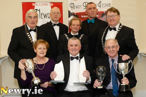 Presenting members of Silken Thomas Players with their awards for their production of Mercury Fur at Newry Drama Festival. Front: Freda O'Connell and Tom Malone, Silken Thomas with Colin Kavanagh Deputy Manager, The Quays Shopping and Leisure, Festival Sponsors, centre. Back from left: Gerry McNulty, Chairman, Newry Drama Festival; Joe McCarrick, Director, RTE All Ireland Drama Festival, Athlone; John McArdle, Mayor, Newry and Mourne District Council; Geoffrey O'Keefe, Adjudicator and Sean Corcoran, Chairman, Amateur Drama Council of Ireland. Photograph: Columba O'Hare Presenting members of Silken Thomas Players with their awards for their production of Mercury Fur at Newry Drama Festival. Front: Freda O'Connell and Tom Malone, Silken Thomas with Colin Kavanagh Deputy Manager, The Quays Shopping and Leisure, Festival Sponsors, centre. Back from left: Gerry McNulty, Chairman, Newry Drama Festival; Joe McCarrick, Director, RTE All Ireland Drama Festival, Athlone; John McArdle, Mayor, Newry and Mourne District Council; Geoffrey O'Keefe, Adjudicator and Sean Corcoran, Chairman, Amateur Drama Council of Ireland. Photograph: Columba O'Hare