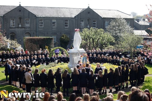Our Lady's Grammar School, Newry celebrates it's 125th Anniversary this year and the tradition of the May Procession has been going on ever since. Students gather in front of the statue of the Virgin Mary in the grounds of the Convent of Mercy. Photograph: Columba O'Hare
