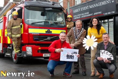 Launching the World Police and Fire Games Concert headlined by JLS are front: Dessie McMahon and Paul McCann, Abbey Event Management Ltd while looking on are Mayor, John McArdle, Sorcha Chipperfield, NI Cancer Fund for Children and members of Newry Fire Service. Photograph: Columba O'Hare