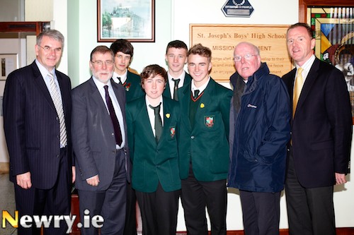 From left Hugh Mallon, Principal; Nelson McCausland, Social Development Minister; Pupils Mathew Loughran, Declan McManus, Caolum McCabe, Allan White; Bishop John McAreavey and David Vint, Chairman, Neighbourhood Renewal Programme.