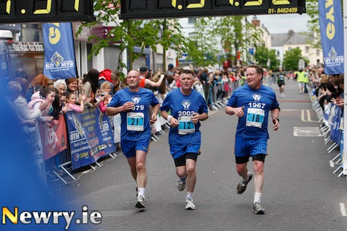 Bosco's Italo Cafolla, Larry McAllinden and Paul O'Connor complete the Half Marathon yesterday. Photograph: Columba O'Hare