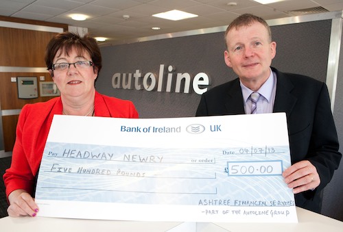 Sheila Quinn, Headway Newry is pictured receiving a £500 donation from Gordon Storrie, Ashtree Financial Services.