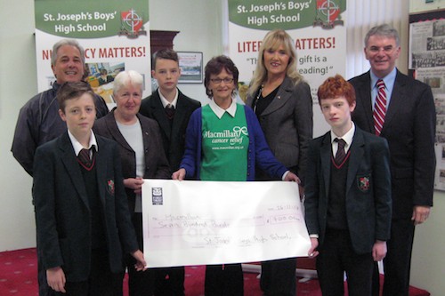 Pictured presenting the cheque to Mrs Kathleen Small of the Newry Macmillian Fund Raising Committee are pioneer pupils, pioneer staff members, Mr P. Mac Parland (RE HOD) and Mr H. Mallon (principal).