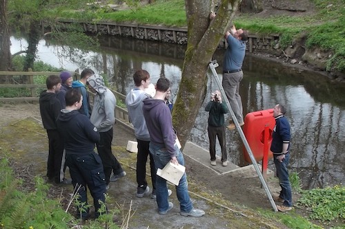 SRC staff David Weir and Eamon Quinn pictured with SRC students who recently helped undertake conservation work along Newry Canal. 