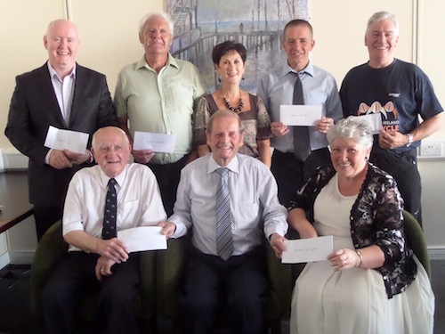Former Mayor Cllr John McArdle presents cheques to his chosen charities following the Mayors Charity Ball.
