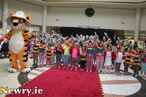 Pictured are some of the local children who took part in Stage School one week Jungle Workshop in Buttercrane performing with Roary the Tiger, Buttercrane's new mascot, in the Centre on Saturday.