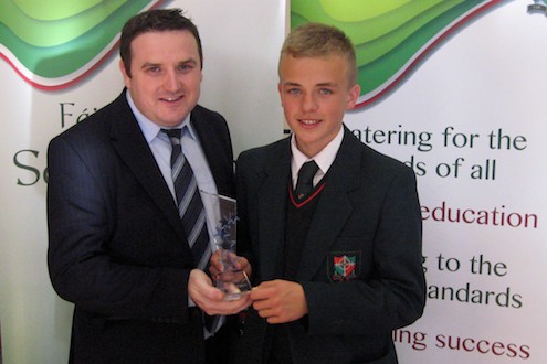 Mr Damien Rooney presents an award to Niall Magill (St Joseph's KS3 pupil of the year)