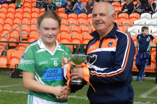 Louise Kenny, senior ladies captain, collects the Championship trophy