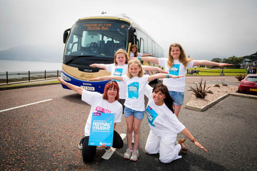 Plane spotters heading for the B/E Aerospace Festival of Flight in Newcastle on Saturday 6 August can choose to arrive in relaxed style thanks to the Translink Park and Ride system operating in the town. Translink scheduler Avril Connor is pictured driving in to meet aviation enthusiasts (kneeling, from left) Translink Service Delivery Manager Kay Sharkey and Joanne Symington from Dundrum alongside(standing, from left) Abbie Connor (10) from Dundrum and sisters Brochan (8) and Lara Sharkey (10) from Newcastle.