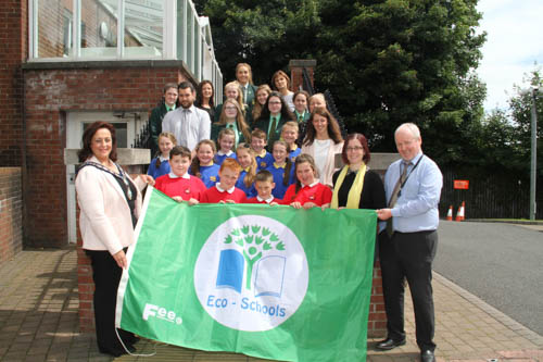 Chairperson Newry, Mourne and Down District Council Gillian Fitzpatrick, Cathy Gorman Eco Schools N.I, Patrick McShane Environmental Co-ordinator NMDDC and the Eco Committees and teachers from Bun Scoil an Iuir, Bessbrook Primary School and Sacred Heart Grammar School who were presented with their first green flags. Other schools awarded were St Colman's Primary School Kilkeel, St Mary's Primary School Newcastle, St Brigid's Primary School Glassdrummond and St Joseph's Primary School Strangford.