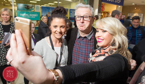 Olivia Smyth and Laura Campbell grab a quick selfie with Specsavers VIP Guest Louis Walsh  who was visiting the Newry store to mark the £250k refurbishment. Photograph: NewRayPics
