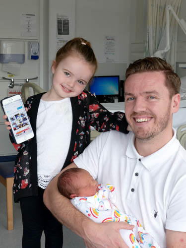 Lileigh, Kevin and baby Sadie Keegan keeping in touch with the new Wi Fi Facility.