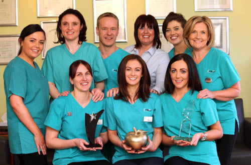 Practice Partners Katrina McKevitt and Doctor Conor McEnhill with the staff of Apple Tree Dental Care, Newry. Practice Partners Katrina McKevitt and Doctor Conor McEnhill with the staff of Apple Tree Dental Care, Newry.