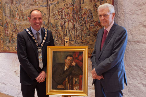 James Fitzpatrick (right), Chairman of the Irish News, presenting a copy of the portrait of Eamon de Valera by the Newry-born artist Margaret Clarke, to Cllr. Mickey Ruane, Chairperson of Newry, Mourne and Down District Council for use by Newry and Mourne Museum