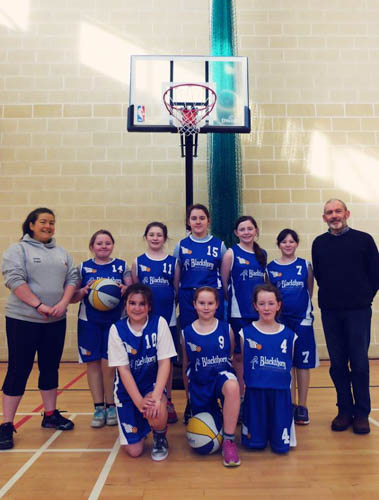 The U12 team with Blackthorn Furniture representatives.