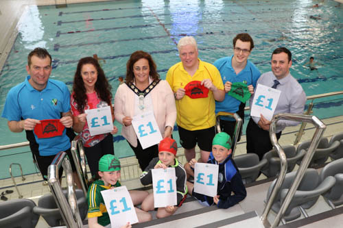 Newry, Mourne and Down District Council staff, Lukasz Wachowiak, Bridie Fitzpatrick, Chairperson Newry, Mourne and Down District Council Councillor Gillian Fitzpatrick, Barney Patterson, Conor Fabb and Kieran Gordon with swimmers Conor Keenan, Colleen and Aoibheann Mynes announce £1 swim offer for the last 2 weeks in August.