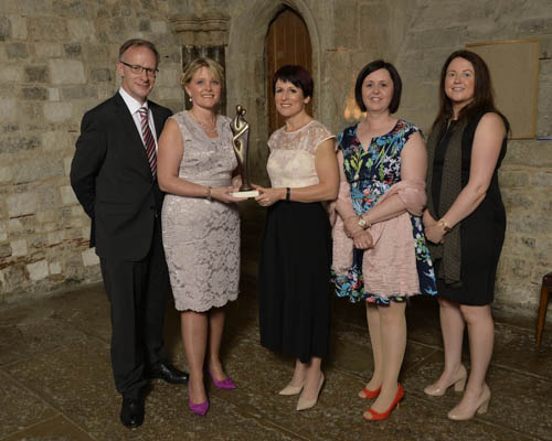 Sarah Atkinson, Managing Director, CHKS presents the Top Hospitals presents a Top Hospital Award to Dr Richard Wright, Medical Director, Aldrina Magwood, Acting Director of Performance and Reform, Dawn Gibson and Judith Paulin, both Clinical Coding Supervisors, Southern Health and Social Care Trust.