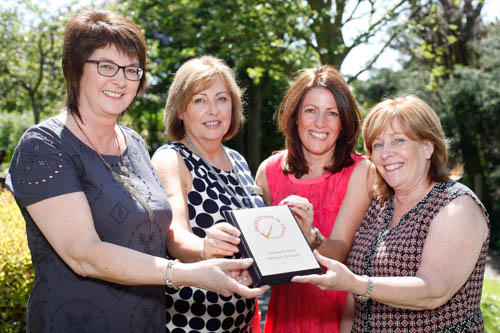 Sandra Adair, left, Volunteer Now presents an  Investing in Volunteers Award to Rosie Teggarty and Andrea McCann, Voluntary Services Co-Ordinators, Southern Area Hospice and Patricia Deane, H.R. Manager, Southern Area Hospice. Photograph: Columba O'Hare